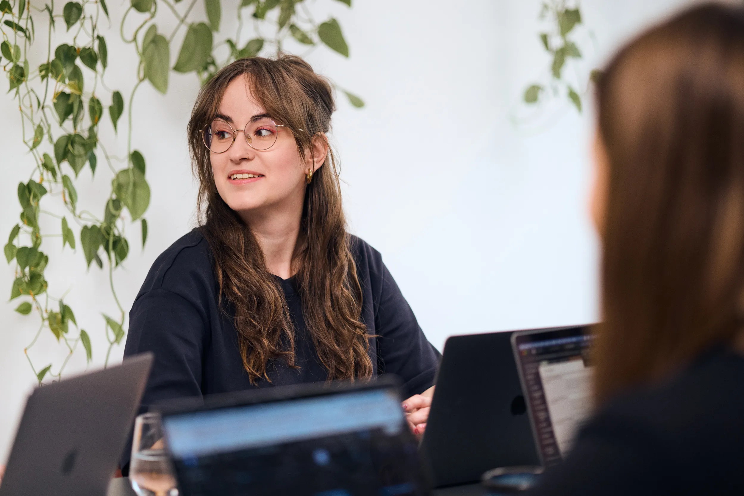 A mohi.to team member in conversation during a project review